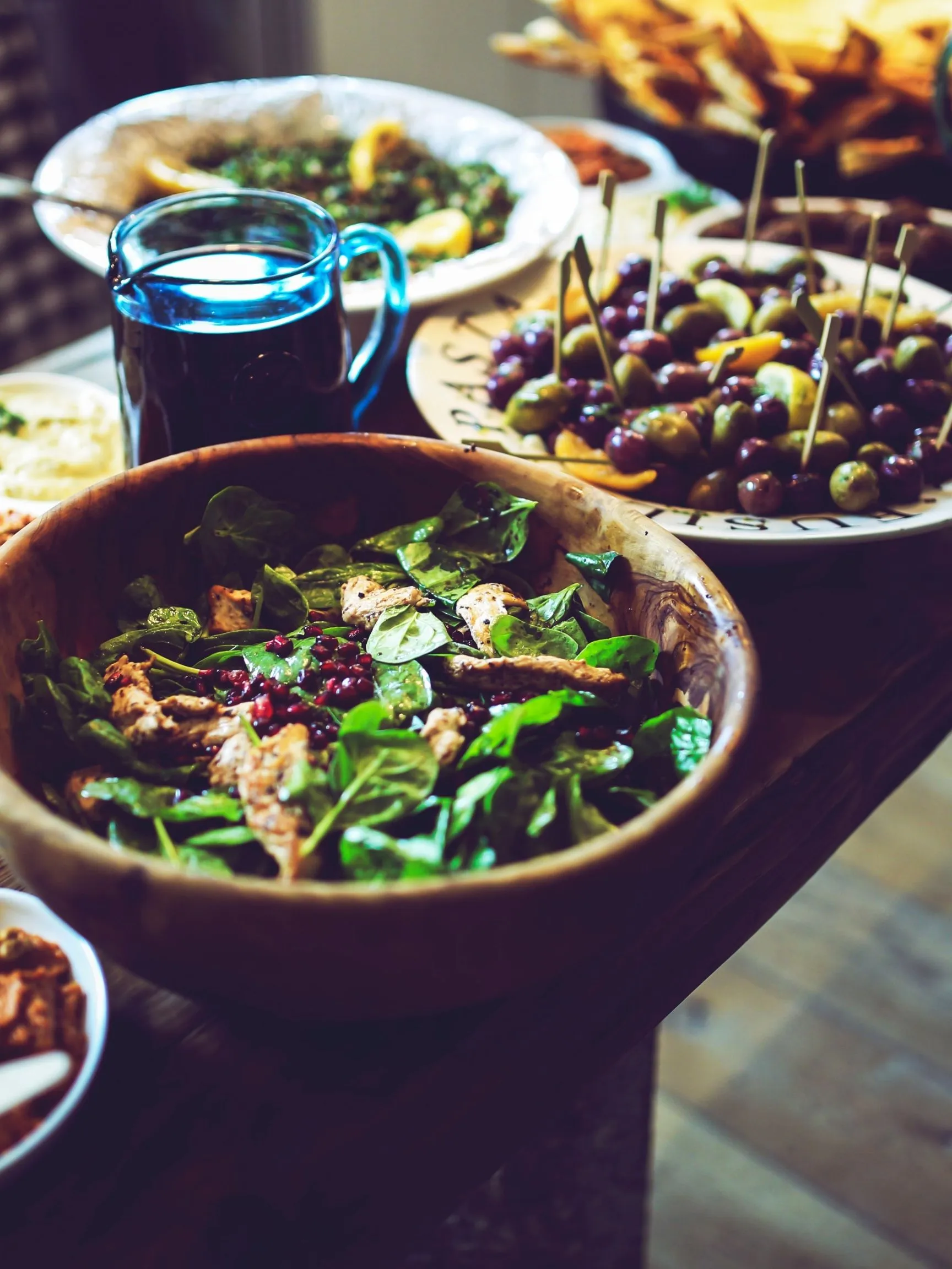 Family-style dinner spread with salad and shared plates by a Platesfull private chef